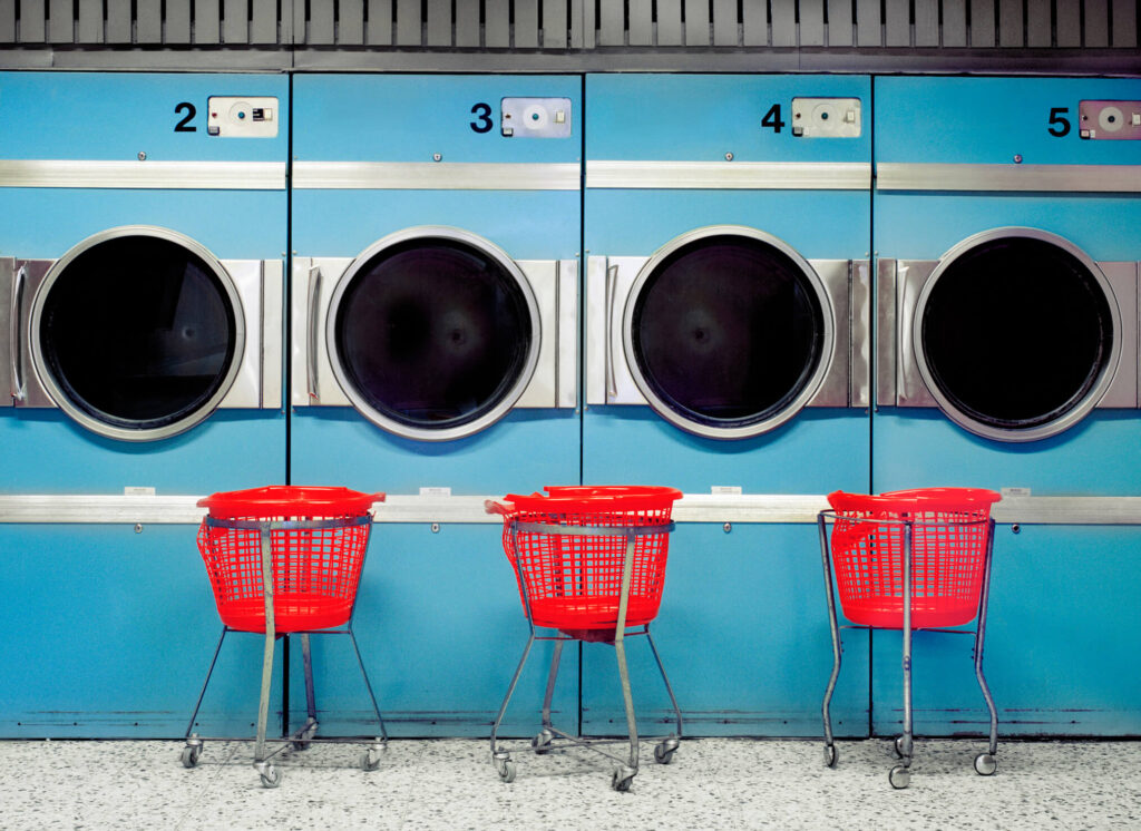 row of blue washing machines