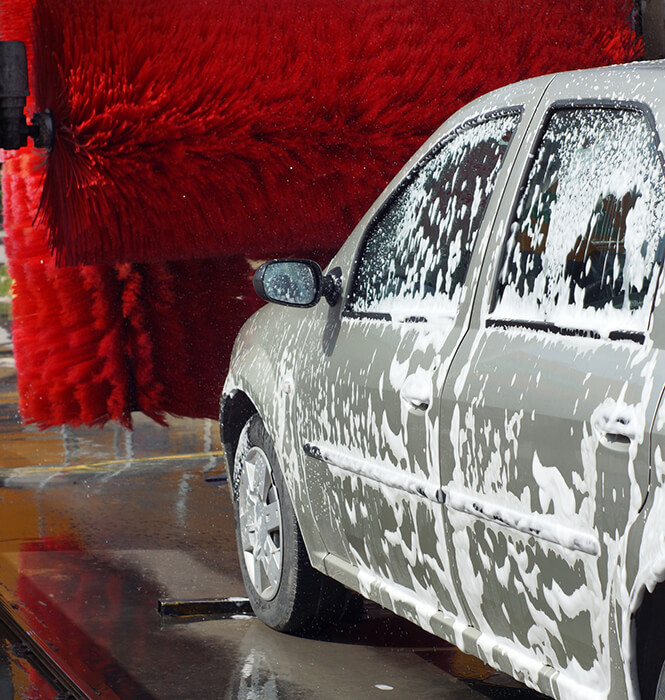 car wash with soap and red rollers