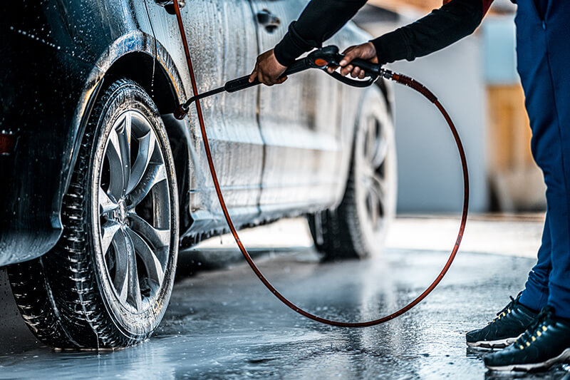 car washing tires with pressure washer